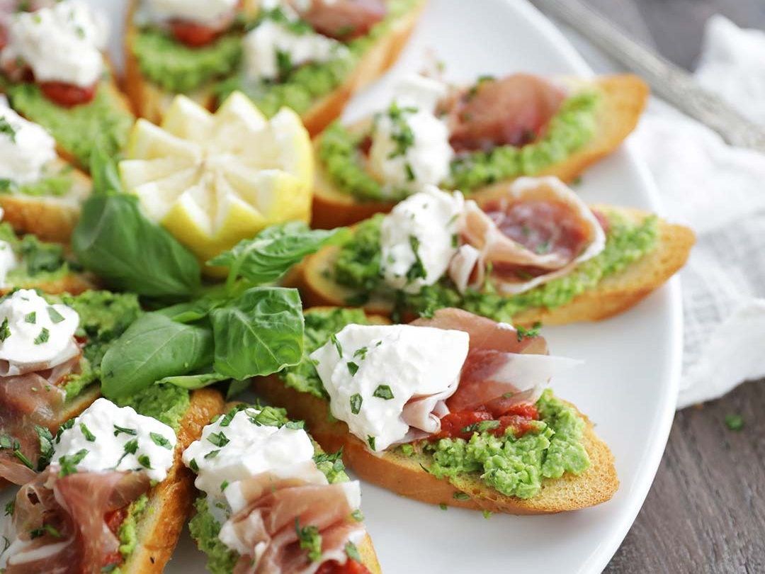 Tomato pea prosciutto burrata bruschetta