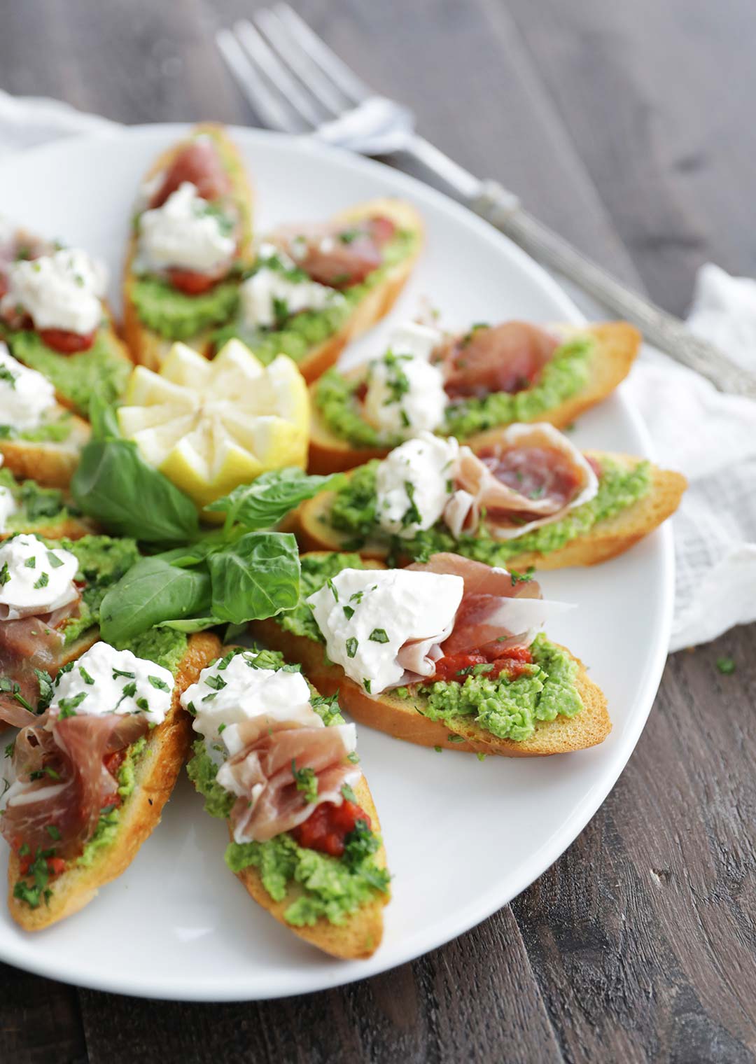 Tomato pea prosciutto burrata bruschetta