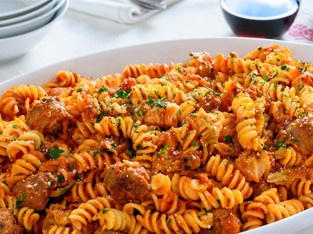 Fusilli with sausage cabbage and tomato sauce