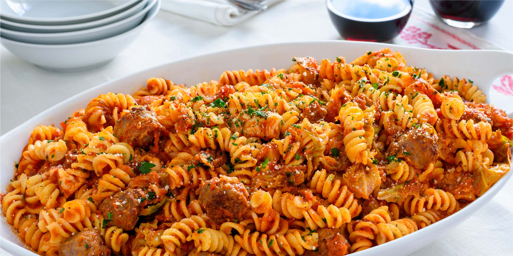 Fusilli with sausage cabbage and tomato sauce