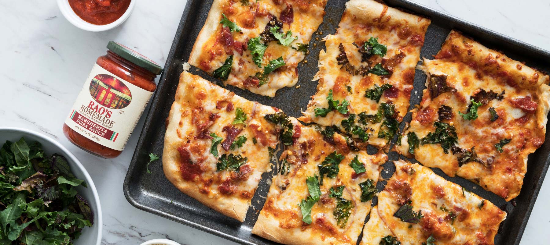 Kale red onion bacon pizza with melted cheese