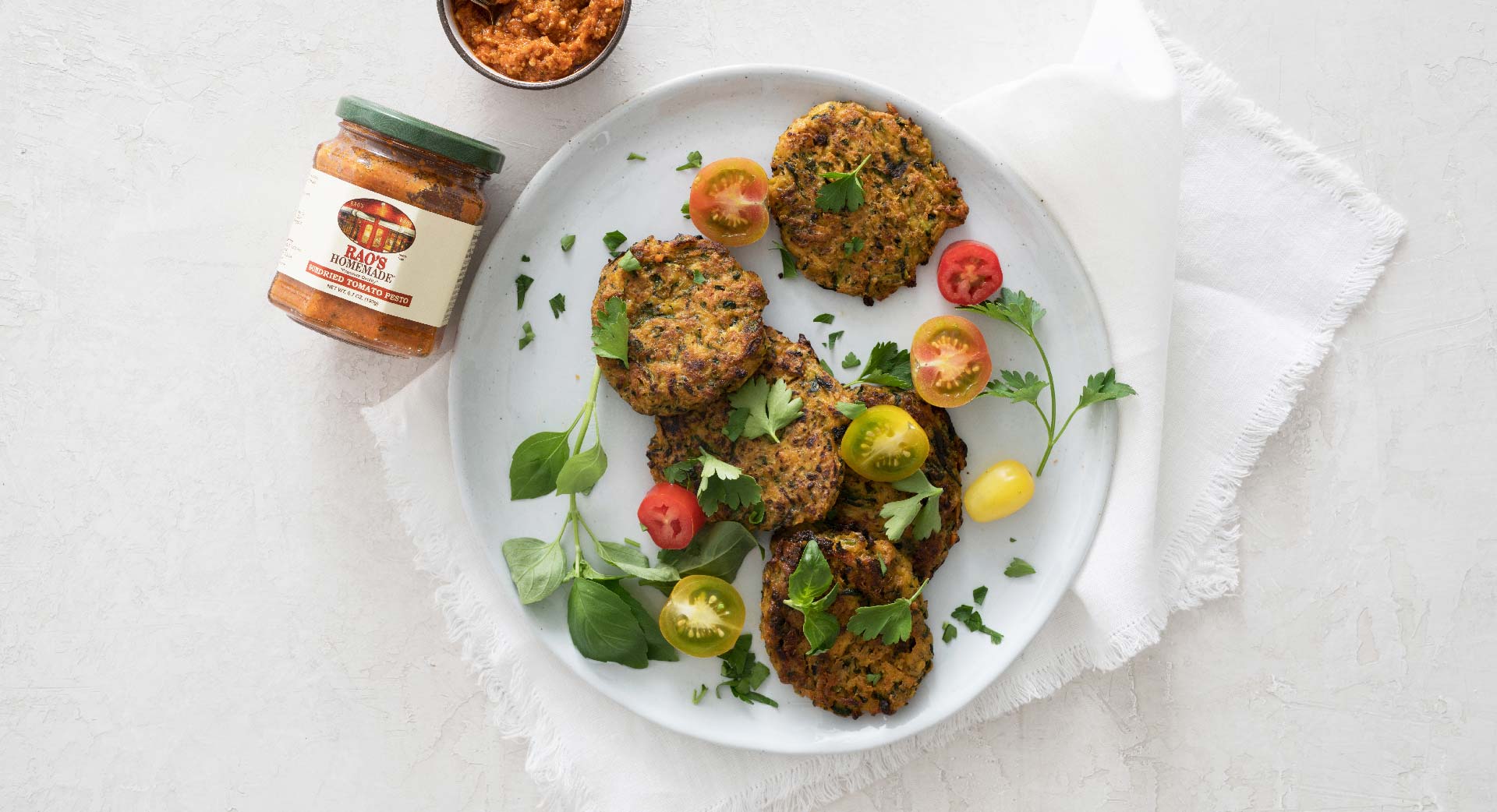 Zucchini fritters with sundried tomato pesto