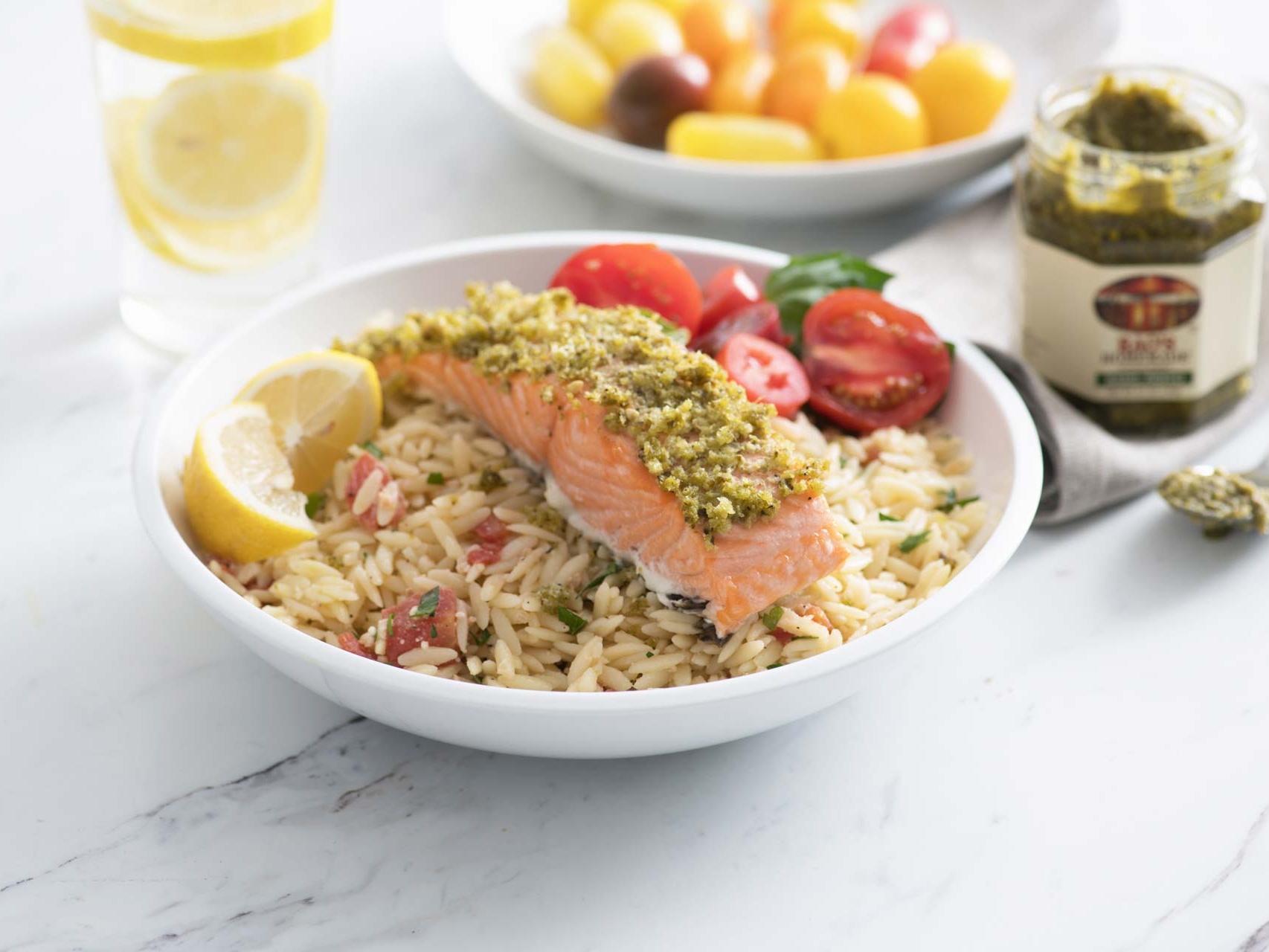 Basil pesto salmon with orzo and Margherita salad