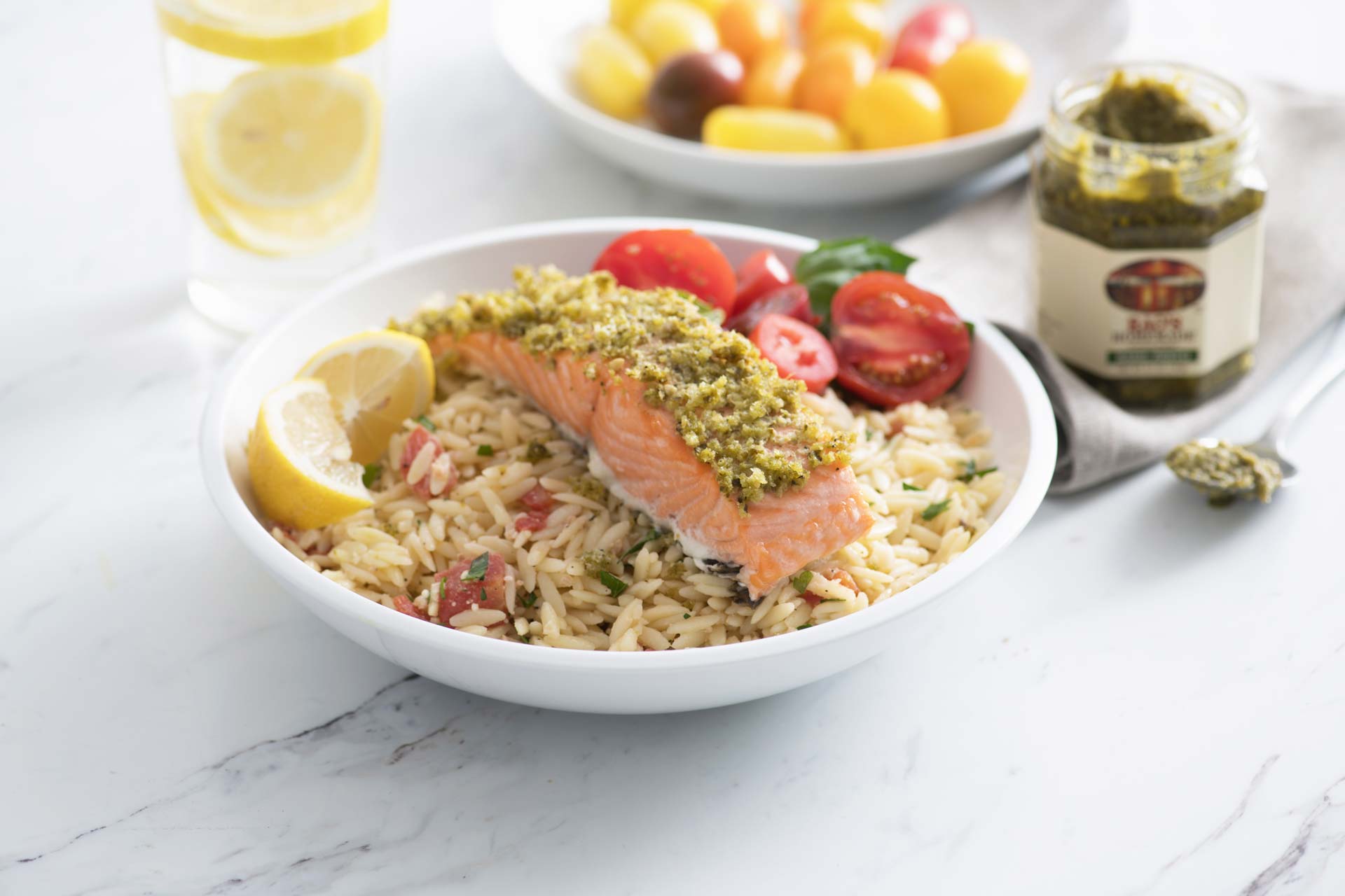 Basil pesto salmon with orzo and Margherita salad