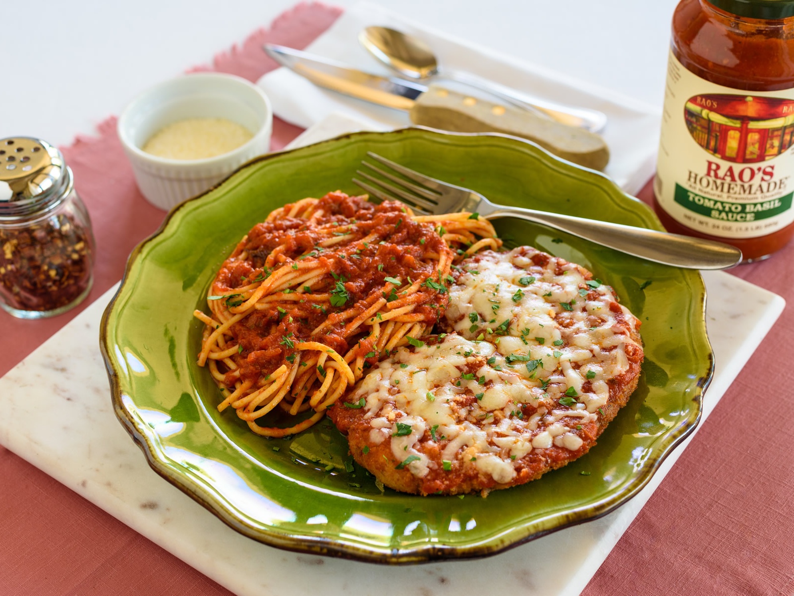 Chicken Parmesan with melted mozzarella and tomato sauce