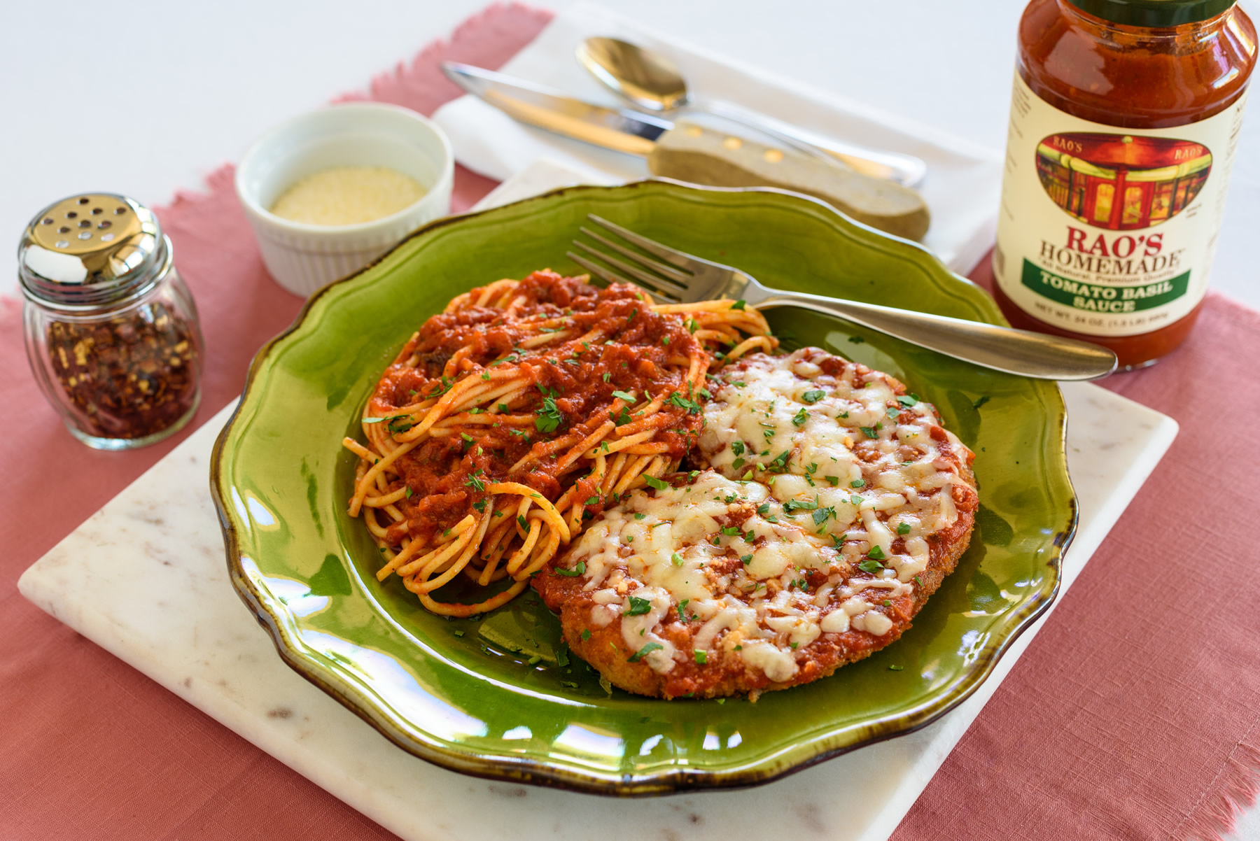 Chicken Parmesan with melted mozzarella and tomato sauce
