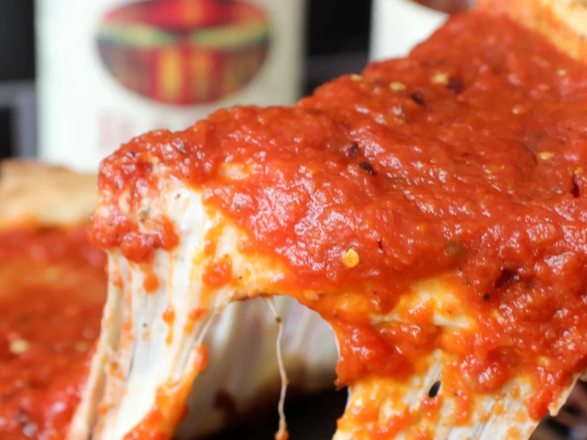 Deep dish pizza with tomato sauce and cheese
