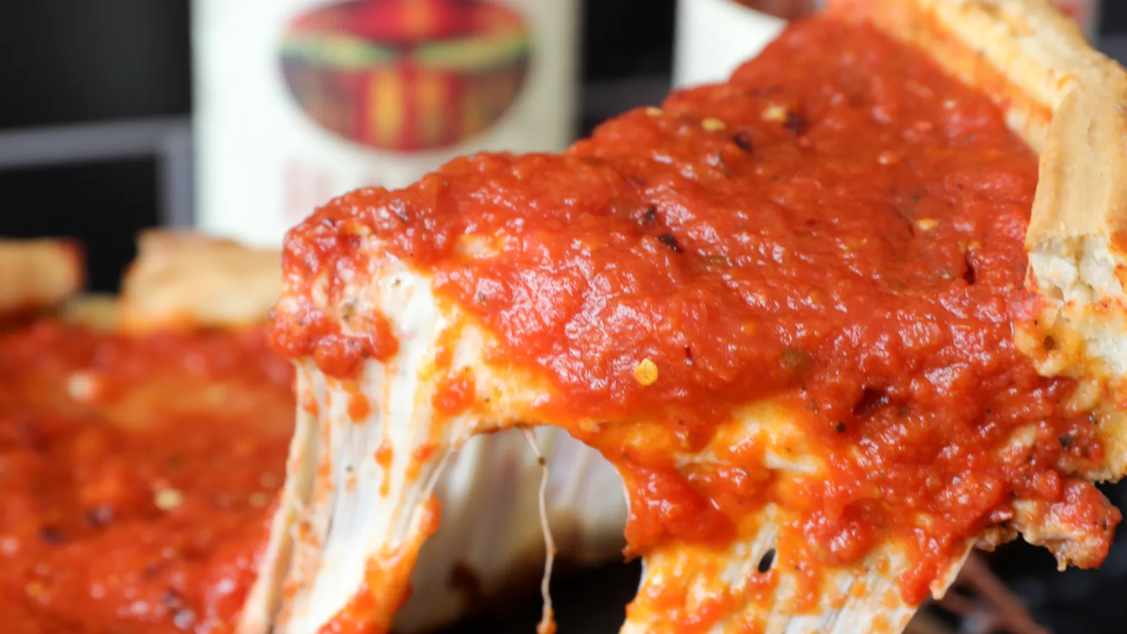 Deep dish pizza with tomato sauce and cheese