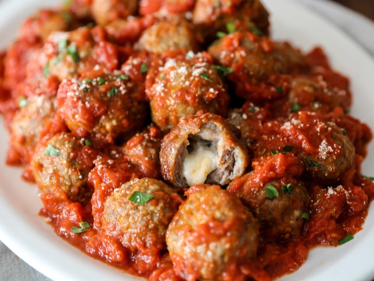 Stuffed meatballs with tomato sauce and herbs