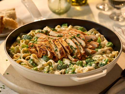 Rao’s Chicken Broccoli Alfredo Fettuccine featuring fettuccine pasta tossed in creamy Alfredo sauce with grilled chicken and broccoli florets.