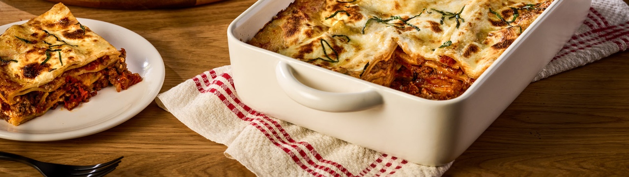 Meat lasagna layered with tomato sauce and cheese