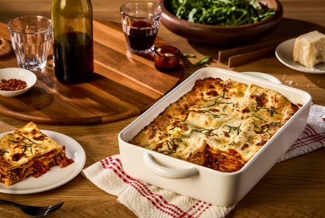 Meat lasagna layered with tomato sauce and cheese